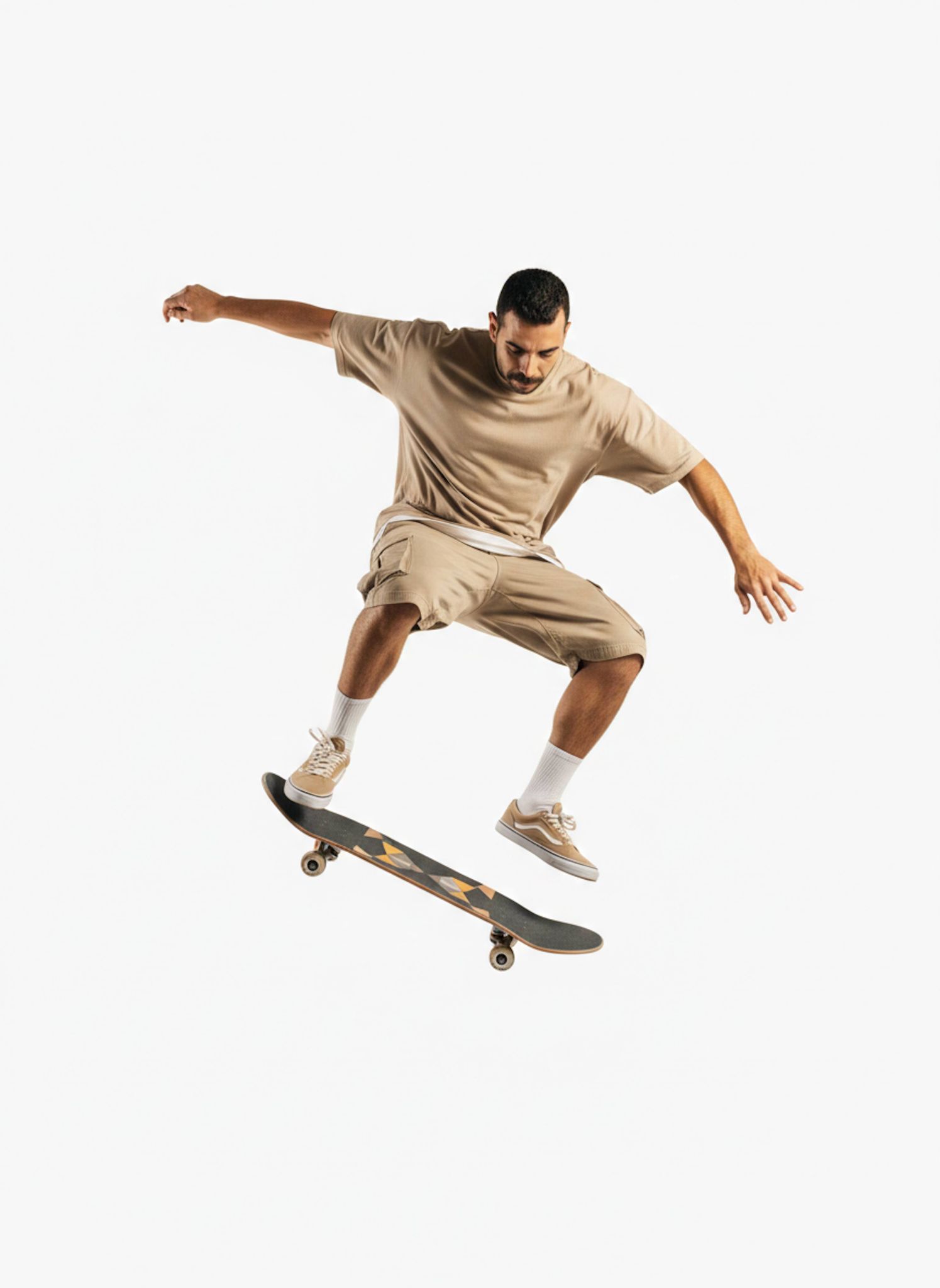 Dynamic full-body portrait of a skateboarder performing a midair trick in beige streetwear with wide-angle perspective