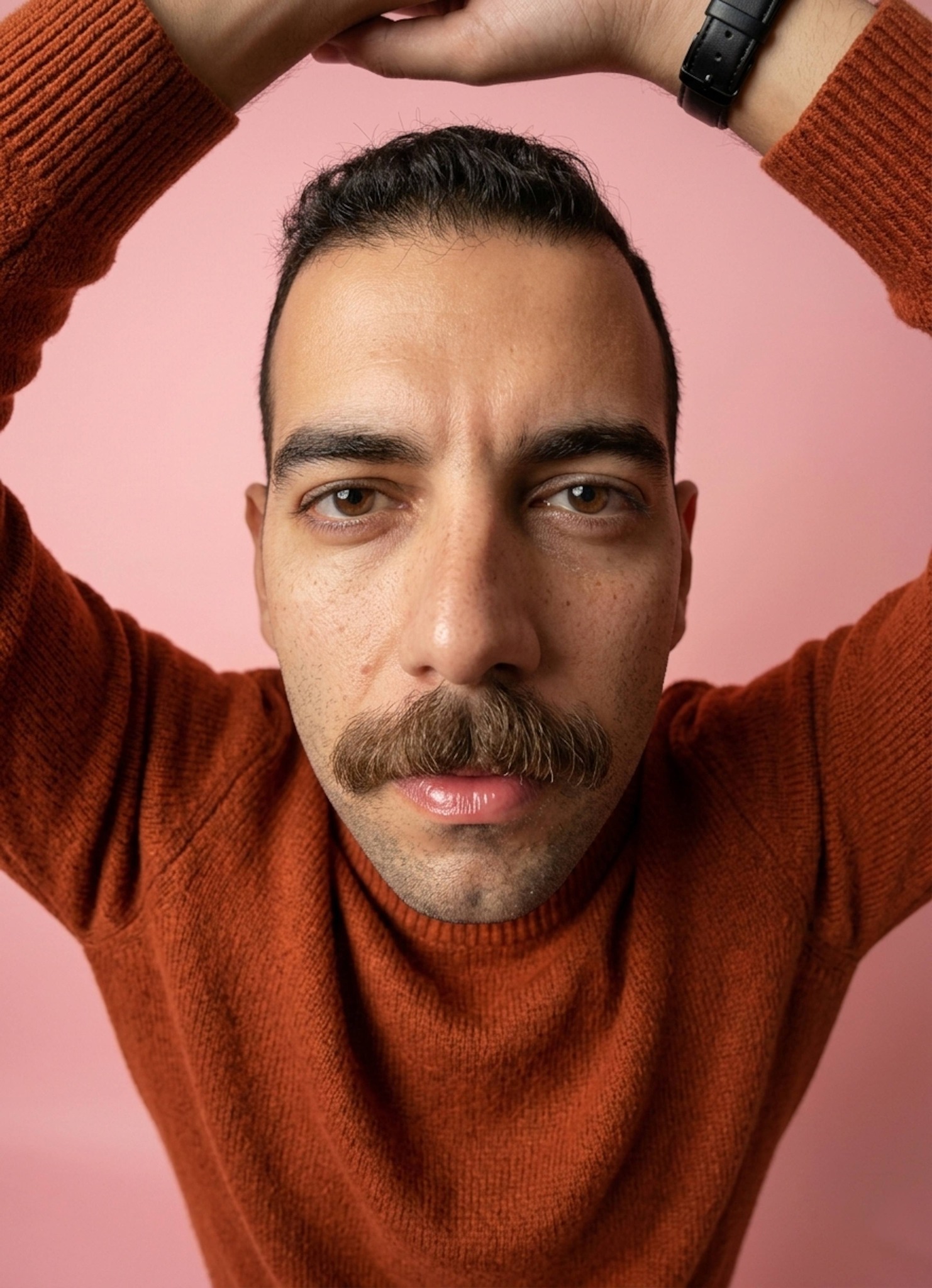 Ultra-realistic top-down fisheye portrait showing freckled face in a rust-orange knit sweater